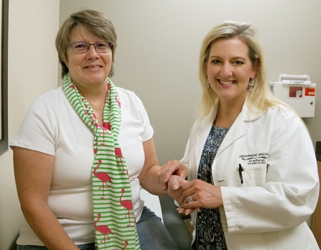 Kim Shank Zehner’s poses with Dr. Monica Morman of CCMG Orthopaedic Specialists after shoulder surgery.